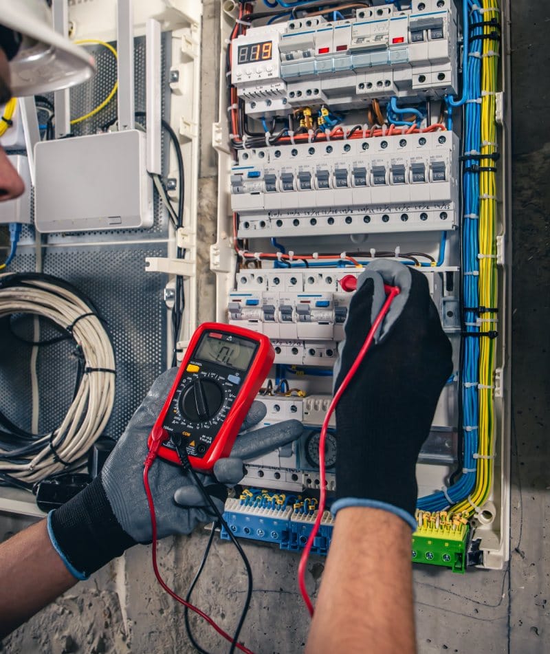 Rcd-man-electrical-technician-working-switchboard-with-fuses